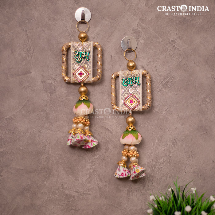 CRASTO INDIA HANDCRAFTED FESTIVE EMBROIDERED LACEWORK SHUBH LABH WITH FLORAL TASSELS.